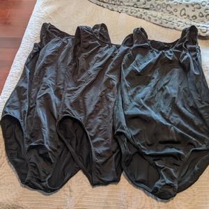 Three shiny black leotards